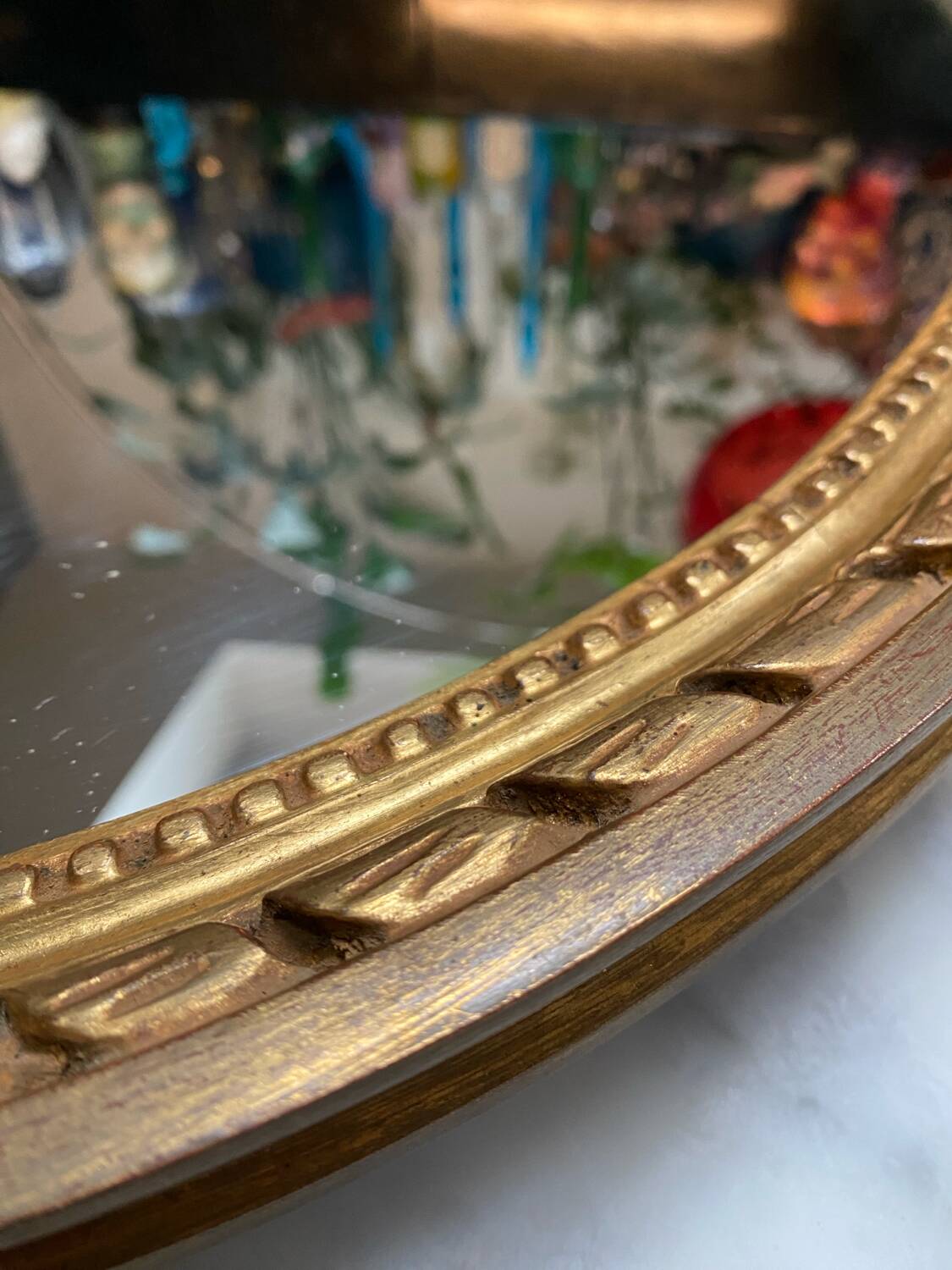 Large oval mirror in wood gilded with fine gold