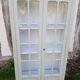 Parisian style display cabinet with 2 doors and 3 shelves in Luxembourg green.