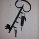 Old wall key holder in the shape of a vintage metal key 4 hooks
