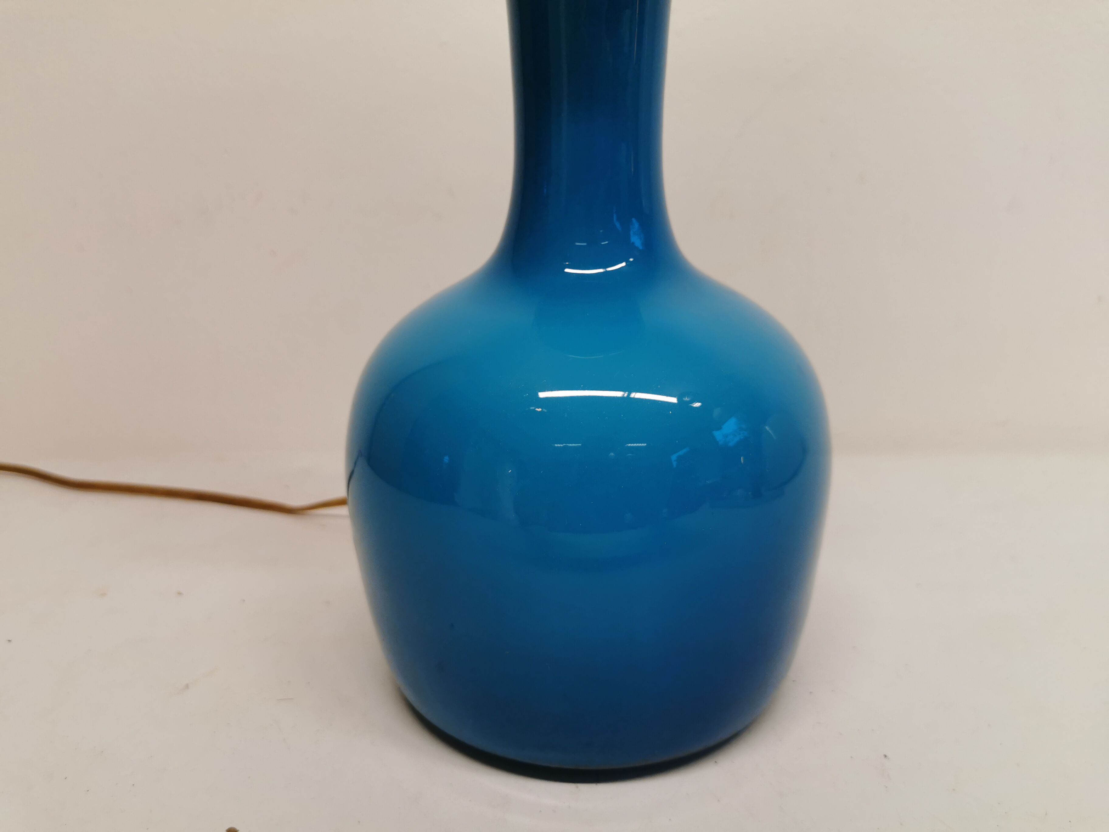 Sea blue glass lamp with brass top