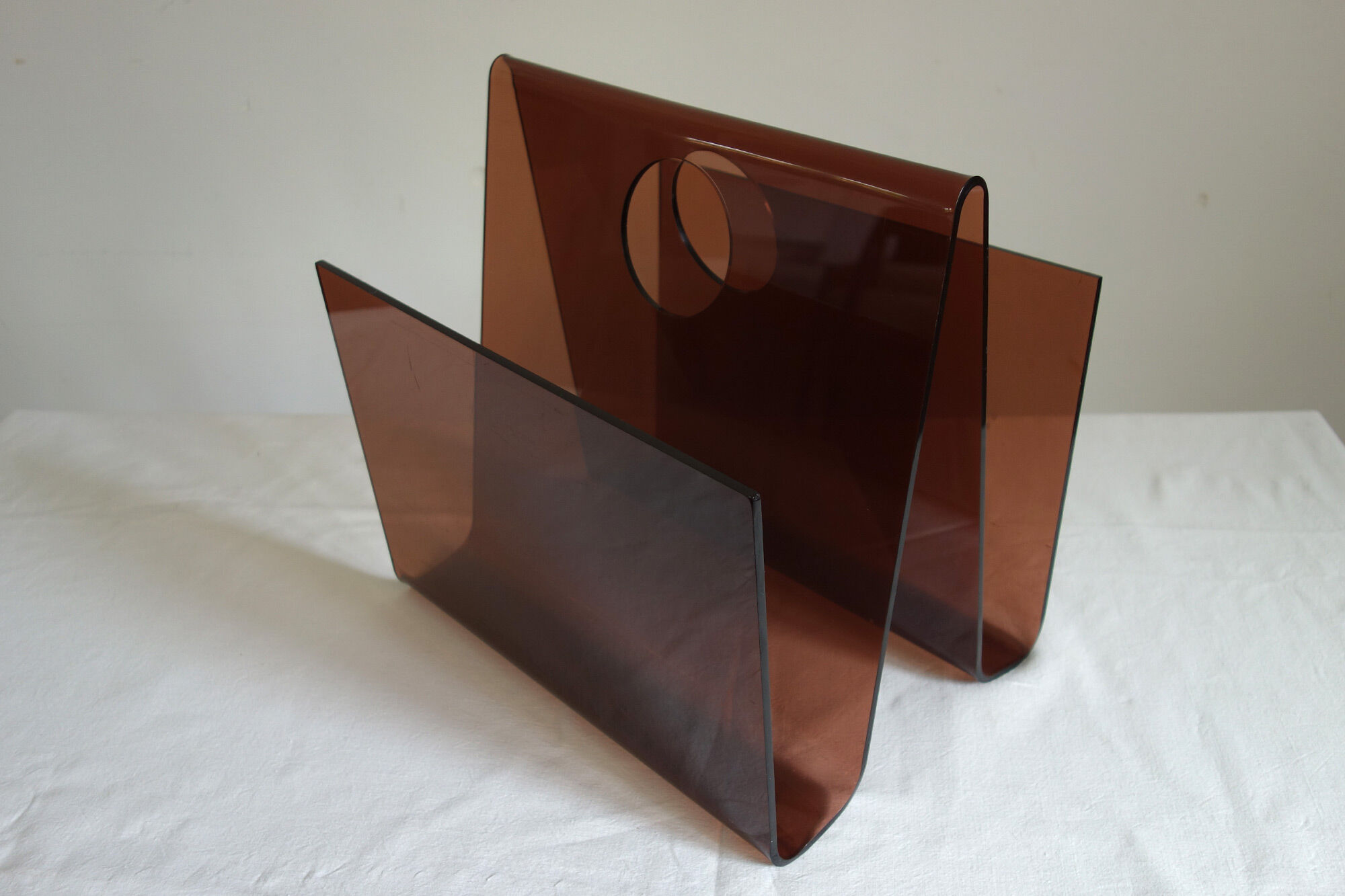 Smoked plexiglass magazine holder, 70s