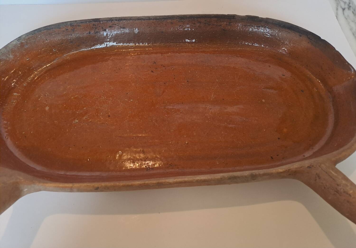 Old glazed terracotta frying pan from the 19th century.