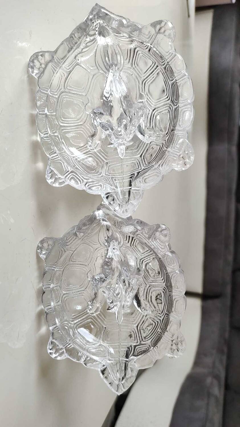 Pair of hand candlesticks/glassware from Portieux/Vallerysthal. In molded glass. Zoomorphic form of turtle carrying a griffin on its back.