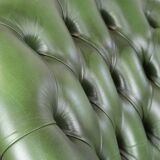 Large green cowhide Chesterfield office chair in English style on wheels