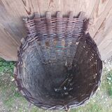 Old grape pickers basket woven wicker vintage wine vines decoration