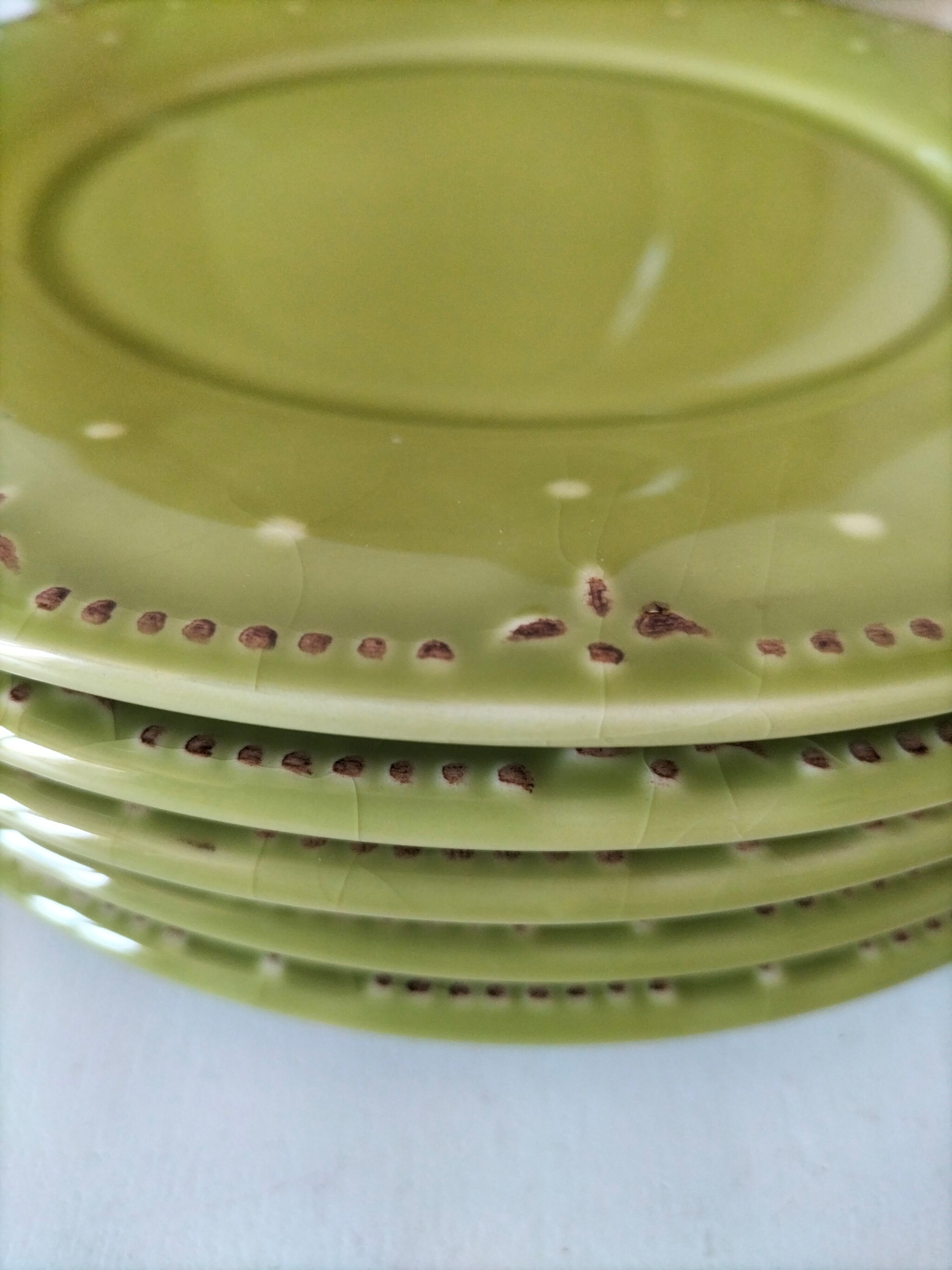 6 olive green plates with dotted relief, workshop ceramic style