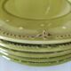 6 olive green plates with dotted relief, workshop ceramic style