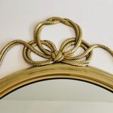 Miroir décoratif oval en laiton orné d'un important noeud torsadé
