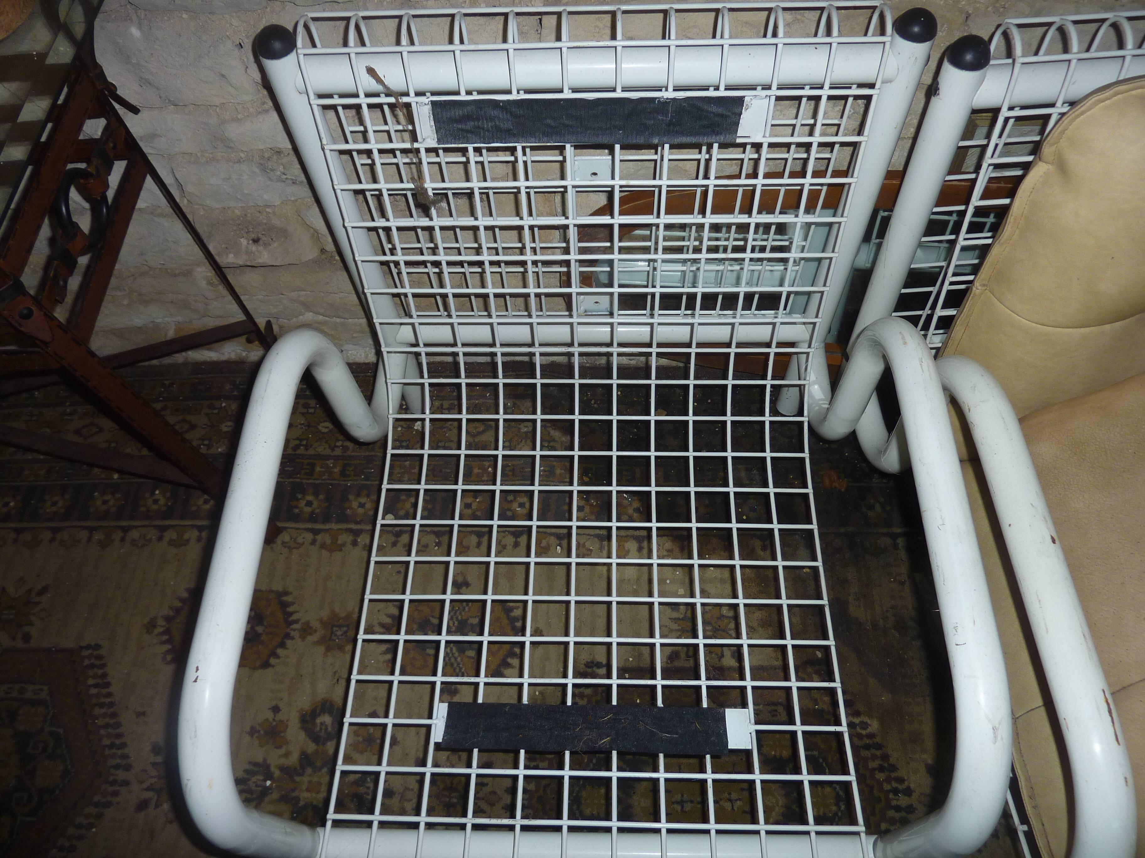 pair of iron armchairs