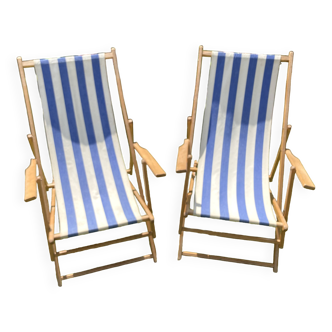 Pair of wooden deck chairs with armrests in blue bayadere fabric