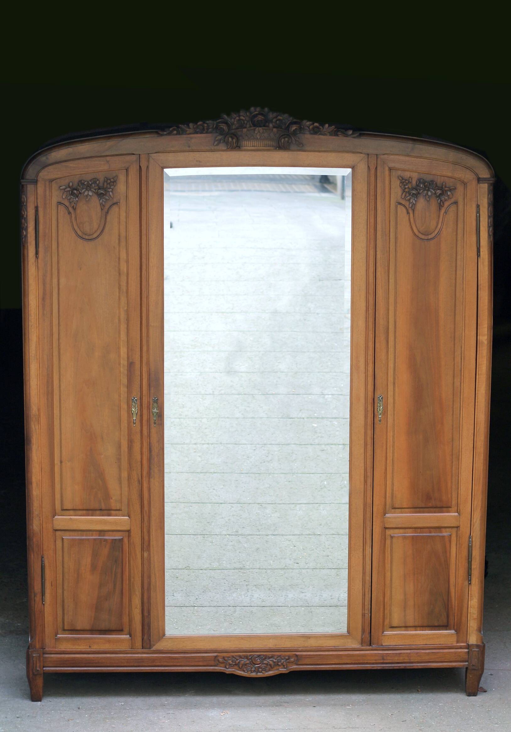Majestic solid walnut wardrobe. Stamped work, late 19th century.