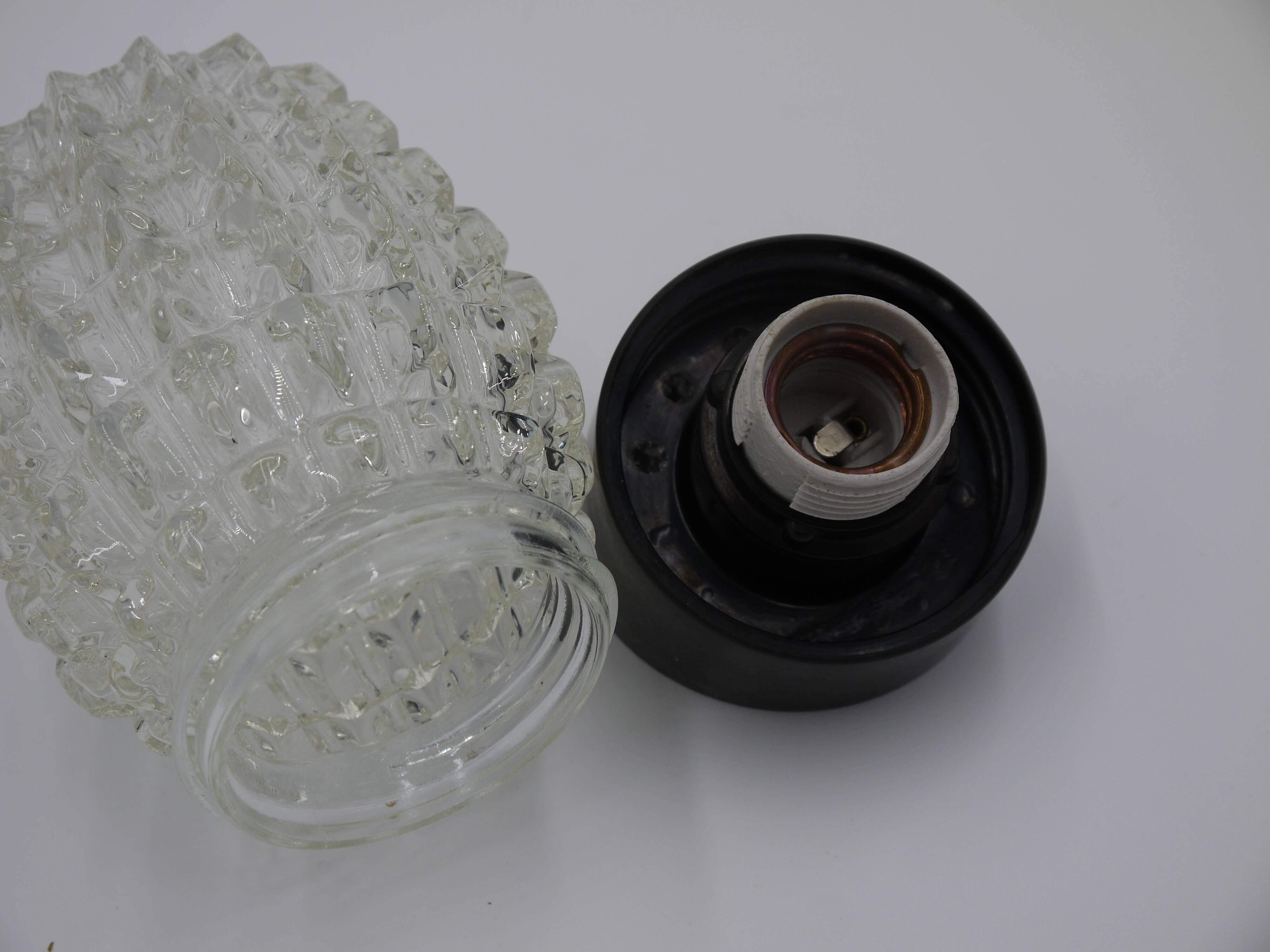 Oblique ceiling lamp in molded glass