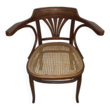 Wooden armchair with caned base