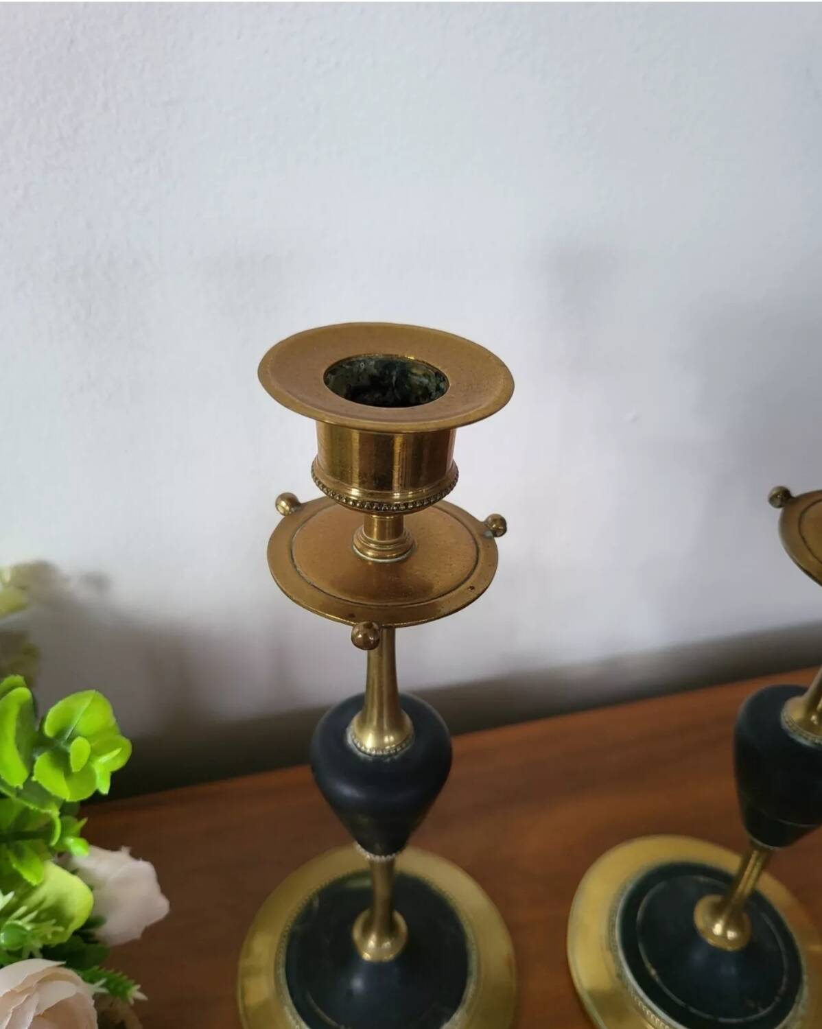 Pair of brass and black hard stone candlesticks