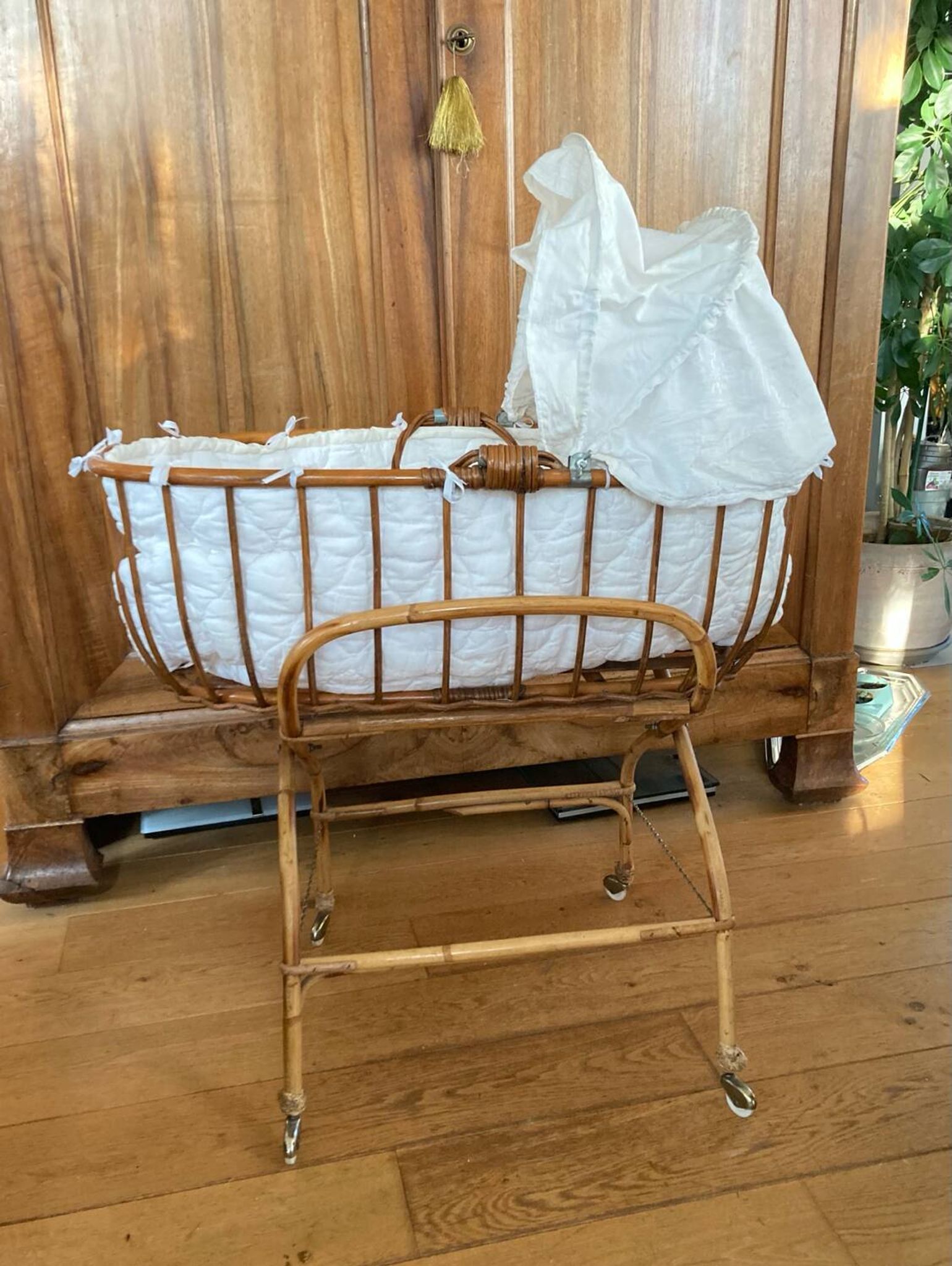 Bamboo, rattan, wicker cradle bassinet from the 1960s with a foldable support.