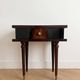 Vintage Art Deco bedside table in dark wood with gold details.