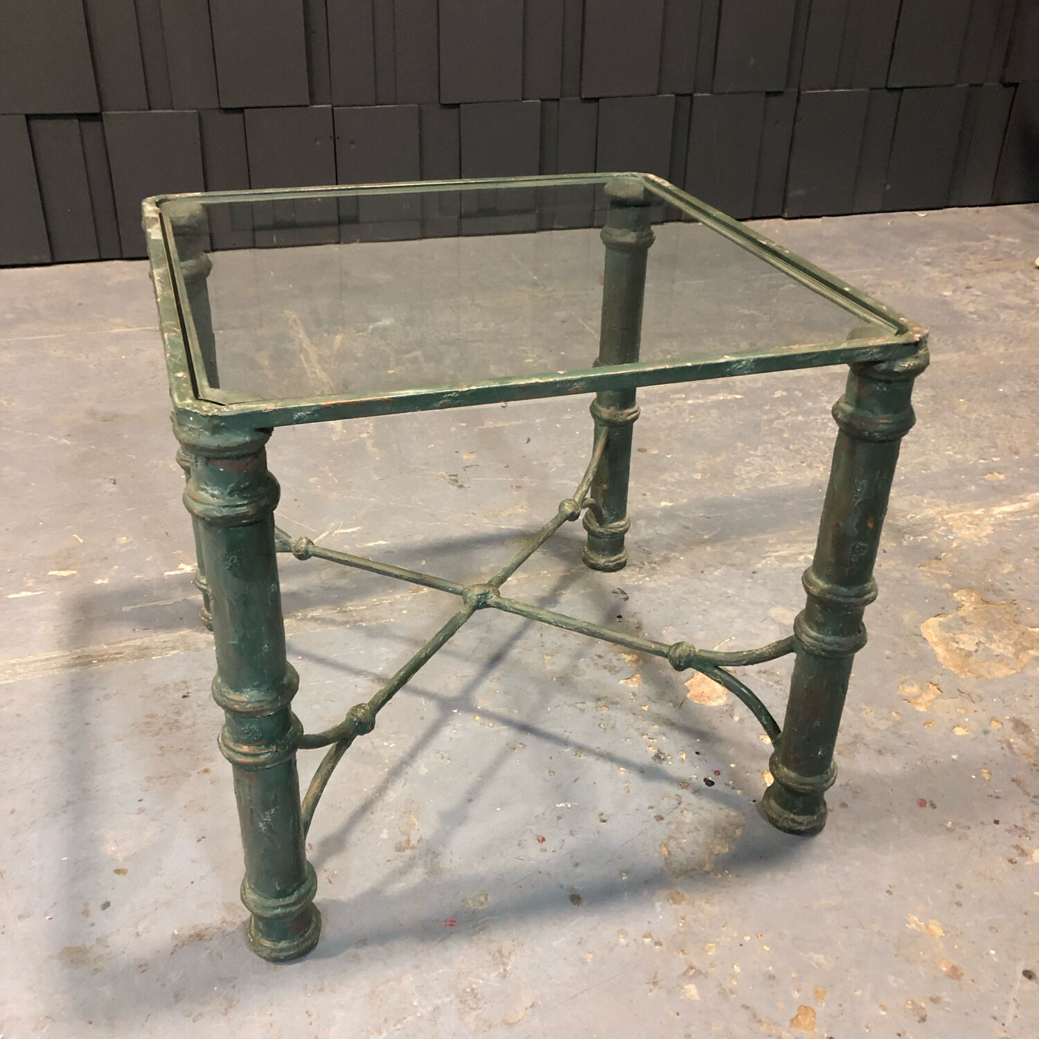 Iron and glass side table with antique patina
