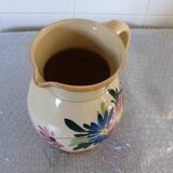 Old pitcher, pot to ance, faience, floral decoration.