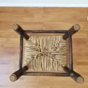 Small rustic vintage wooden and straw stool -