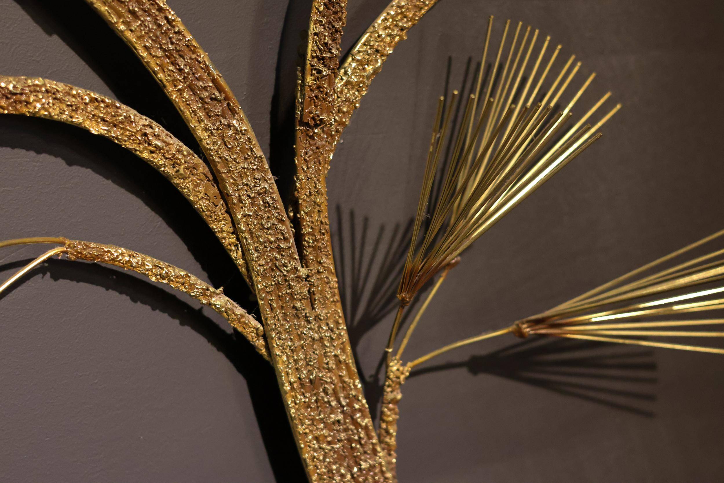 Large wall sculpture in the shape of a tree needle in brass by Curtis Jeré, mid-century modern.