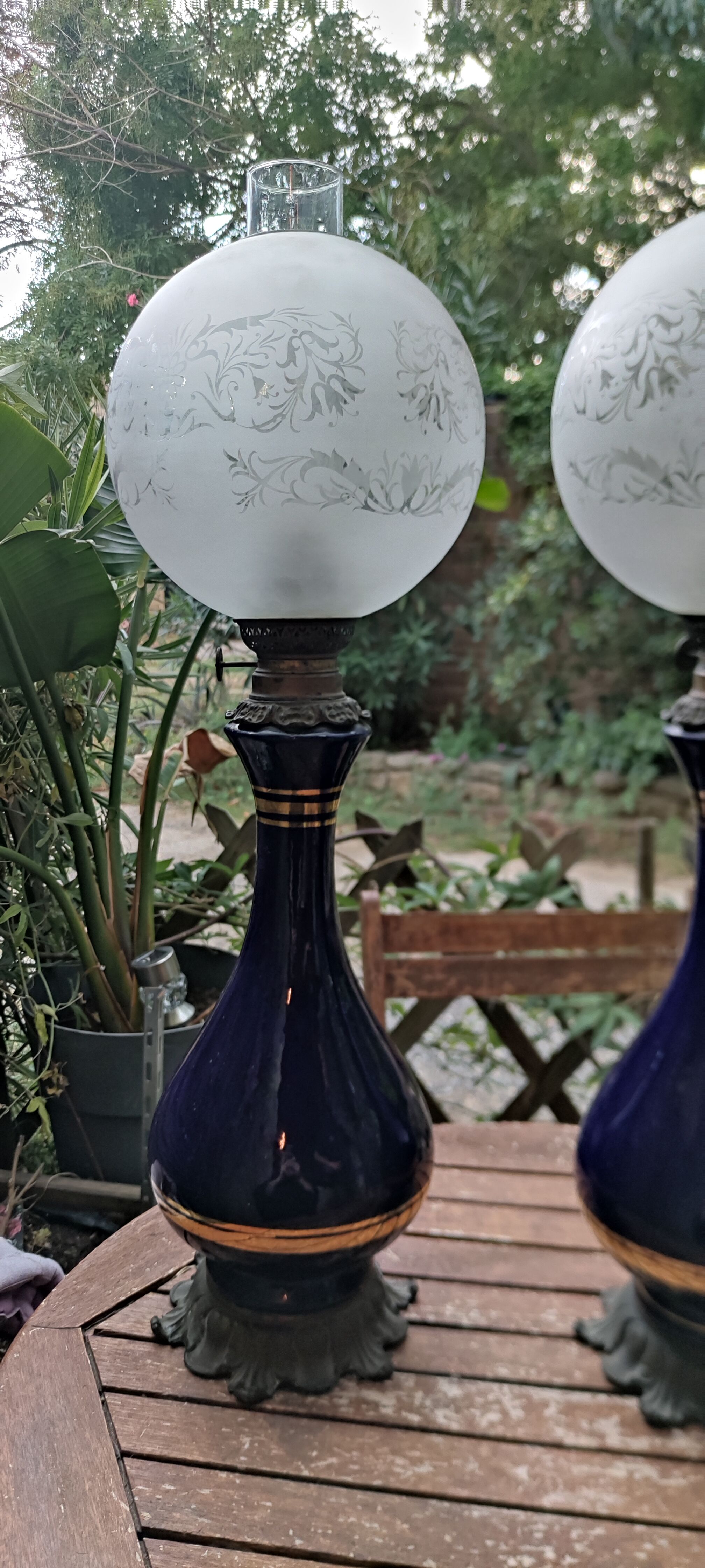 Pair of dark blue kerosene lamps