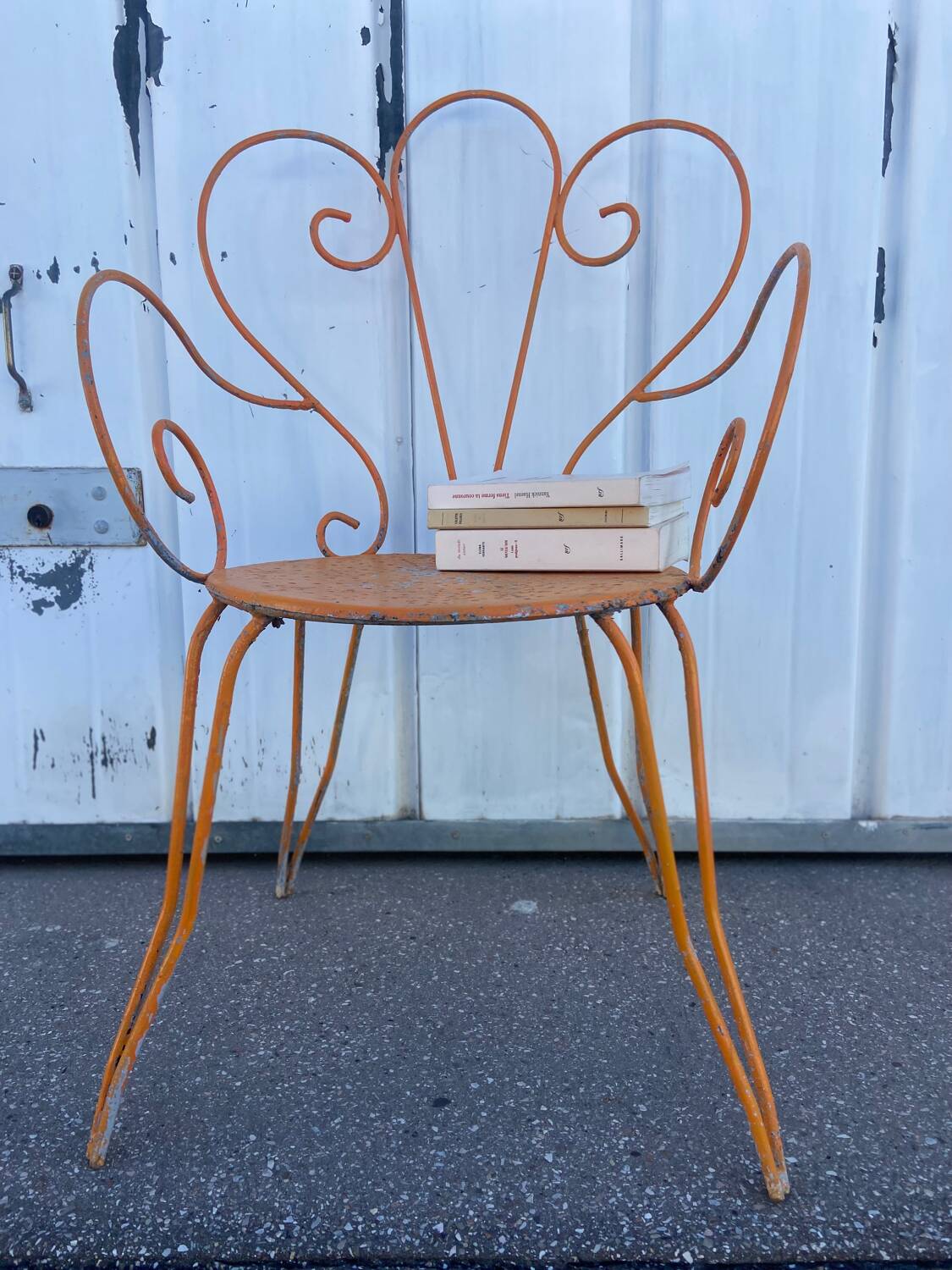 Orange wrought iron chair