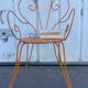 Orange wrought iron chair