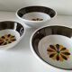 Set of three Italian deep plates from the 1970s, with ochre brown floral decoration.
