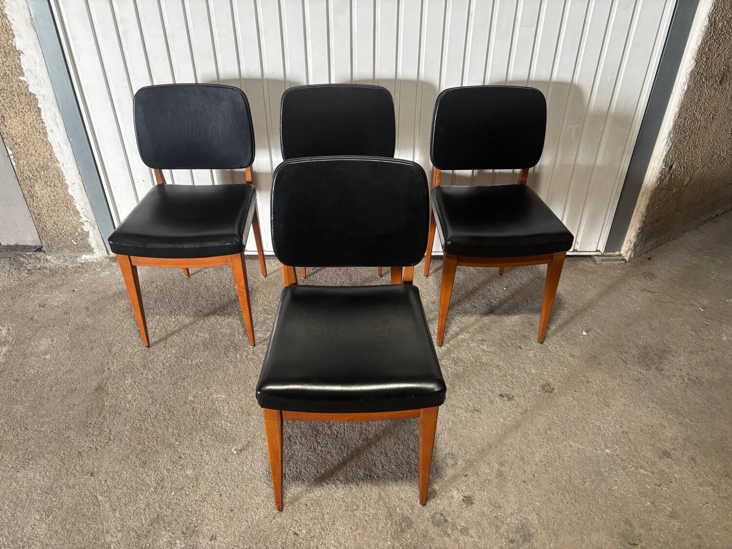 Set of 4 vintage 1960s chairs in wood and black faux leather – design