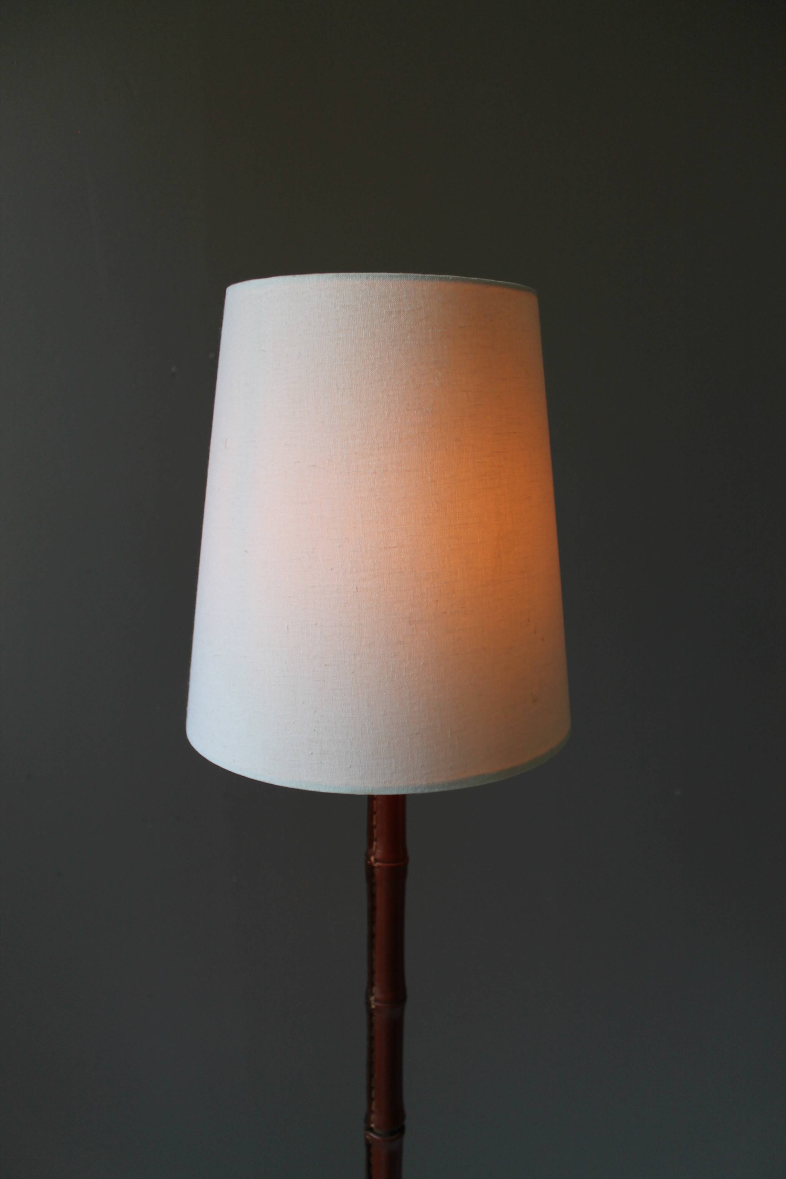 Vintage floor lamp with bamboo-style leather base