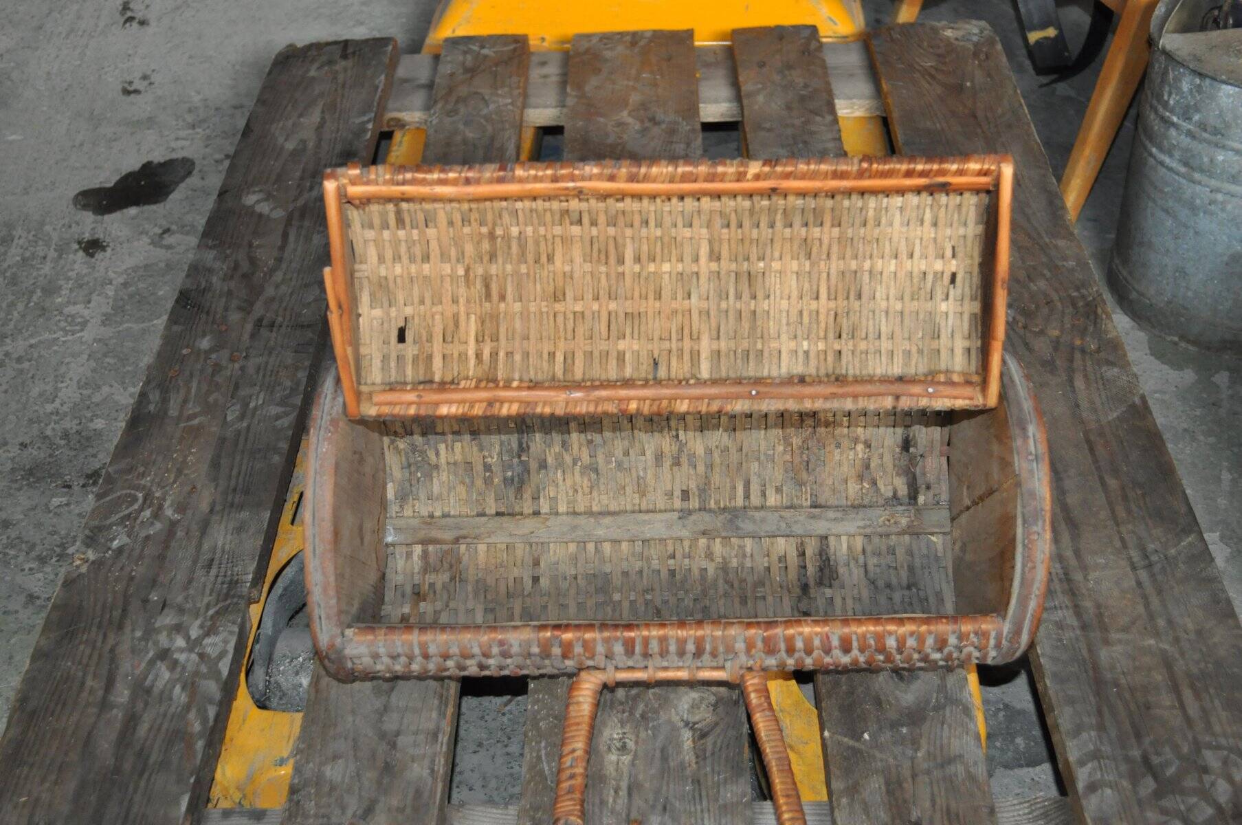 Vintage brown wicker cylindrical basket from the 1940s — long case for a bottle