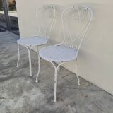 Pair of wrought iron garden chairs, antique manufacture