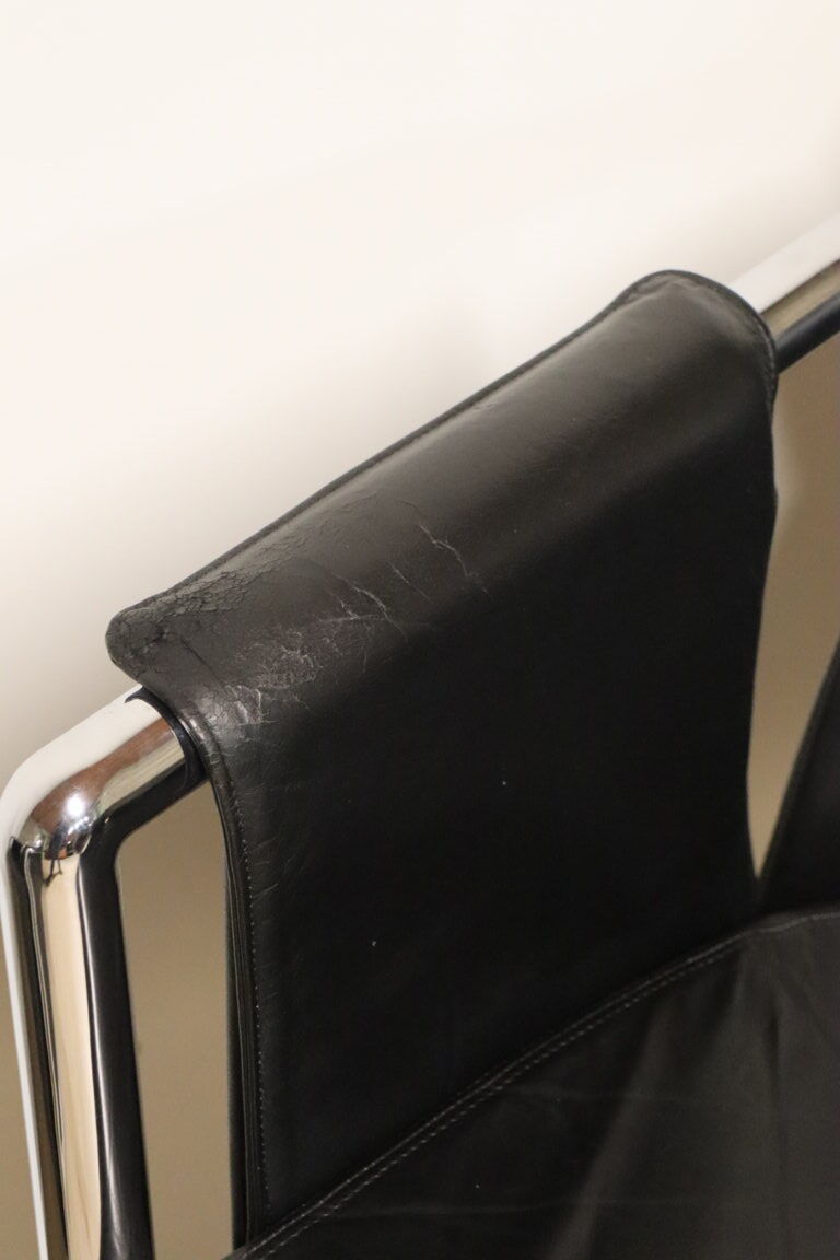 Pair of armchairs in synthetic leather and chromed metal, 1970