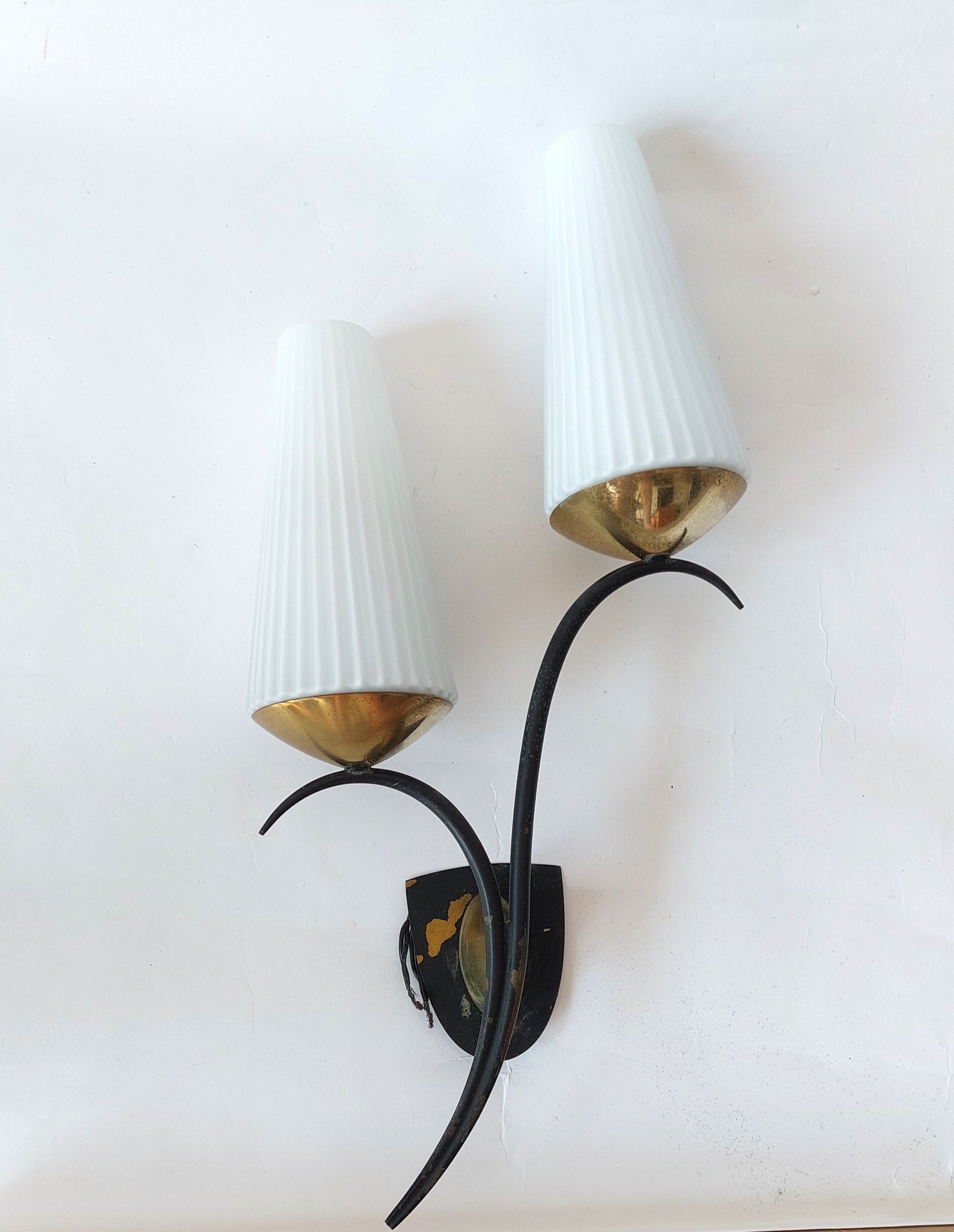 Wall lamp in black metal and gilded brass 1960 with two lights.