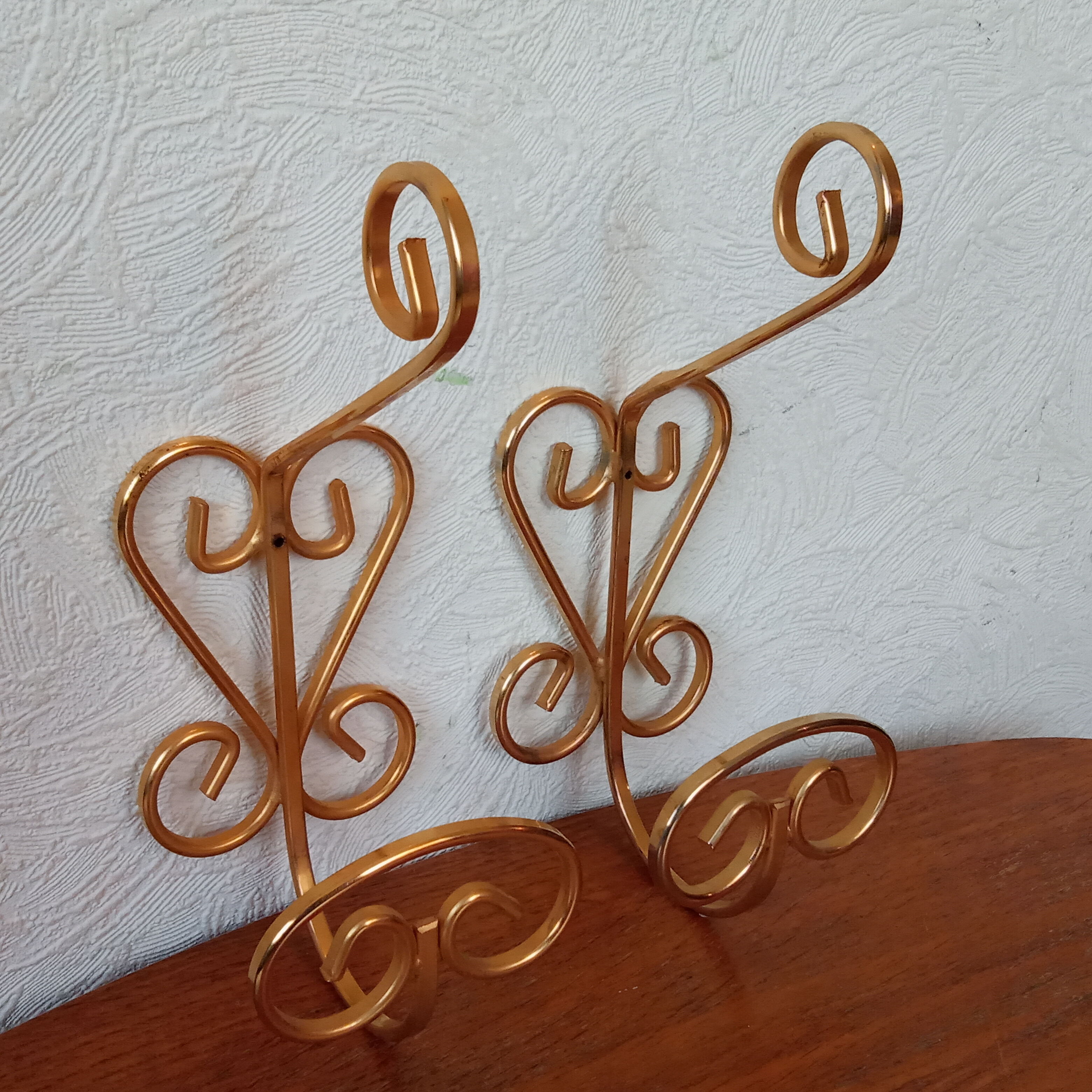 Pair of vintage gold coat hooks