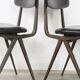 Pair of industrial style chairs in metal and faux black leather