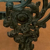 Cast iron bed with floral decorations