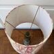 Empire style lamp with a toile de Jouy shade.