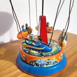 Old tin carousel toy