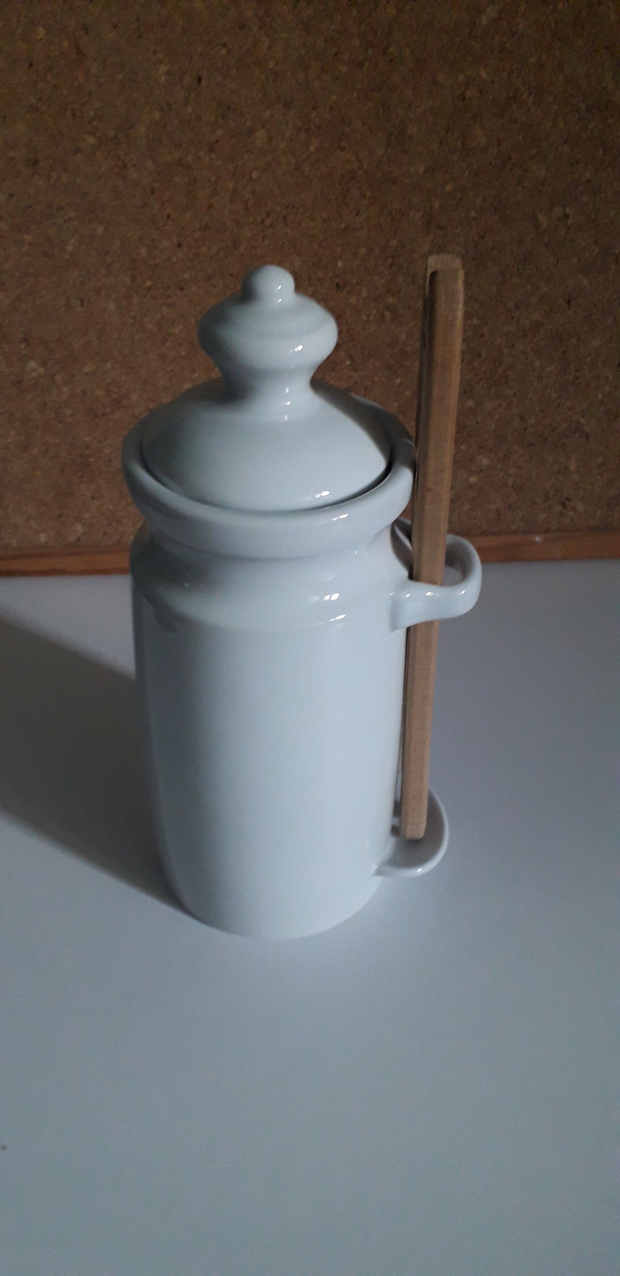 White porcelain pot for storing pickles or fruits with alcohol