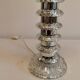 Table lamp made of transparent crystal glass and silver colored spacers.