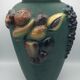 Green ceramic vase with polychrome decoration of fruits and vegetables in relief 33.5 cm