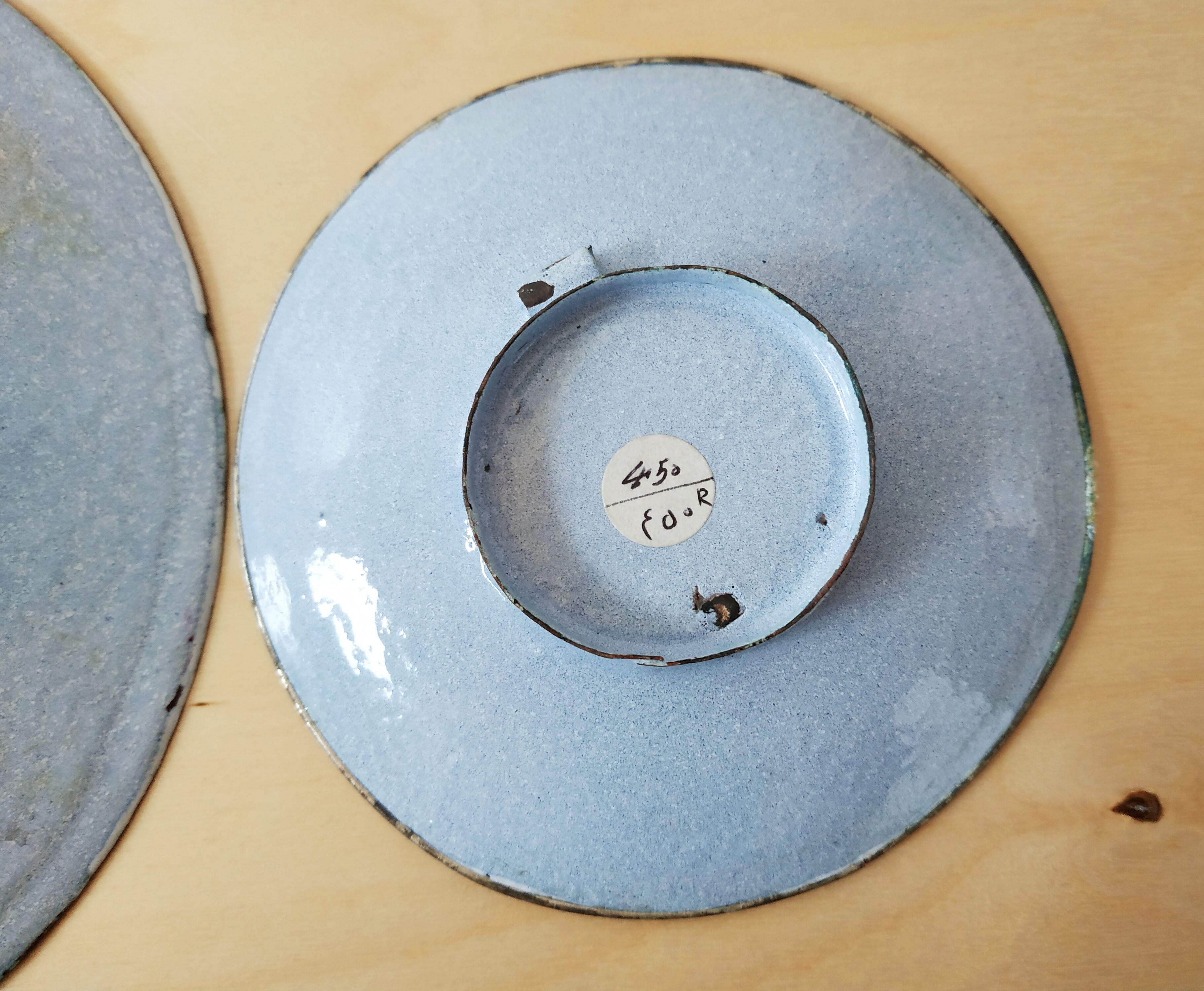 Plate and two decorative saucers enamelled with Persia decoration, circa 1940
