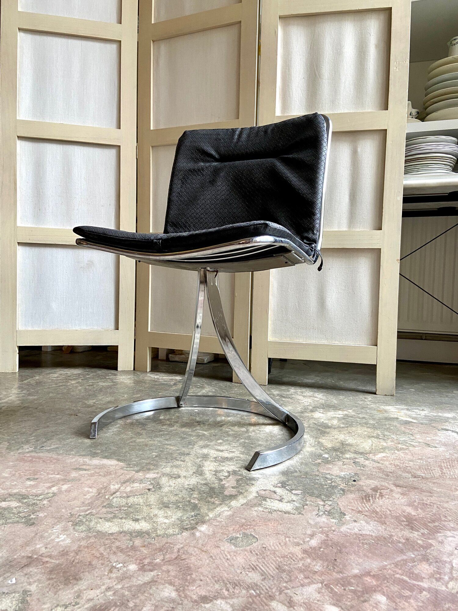 2 chairs in chromed metal and black woven skaï 1970s