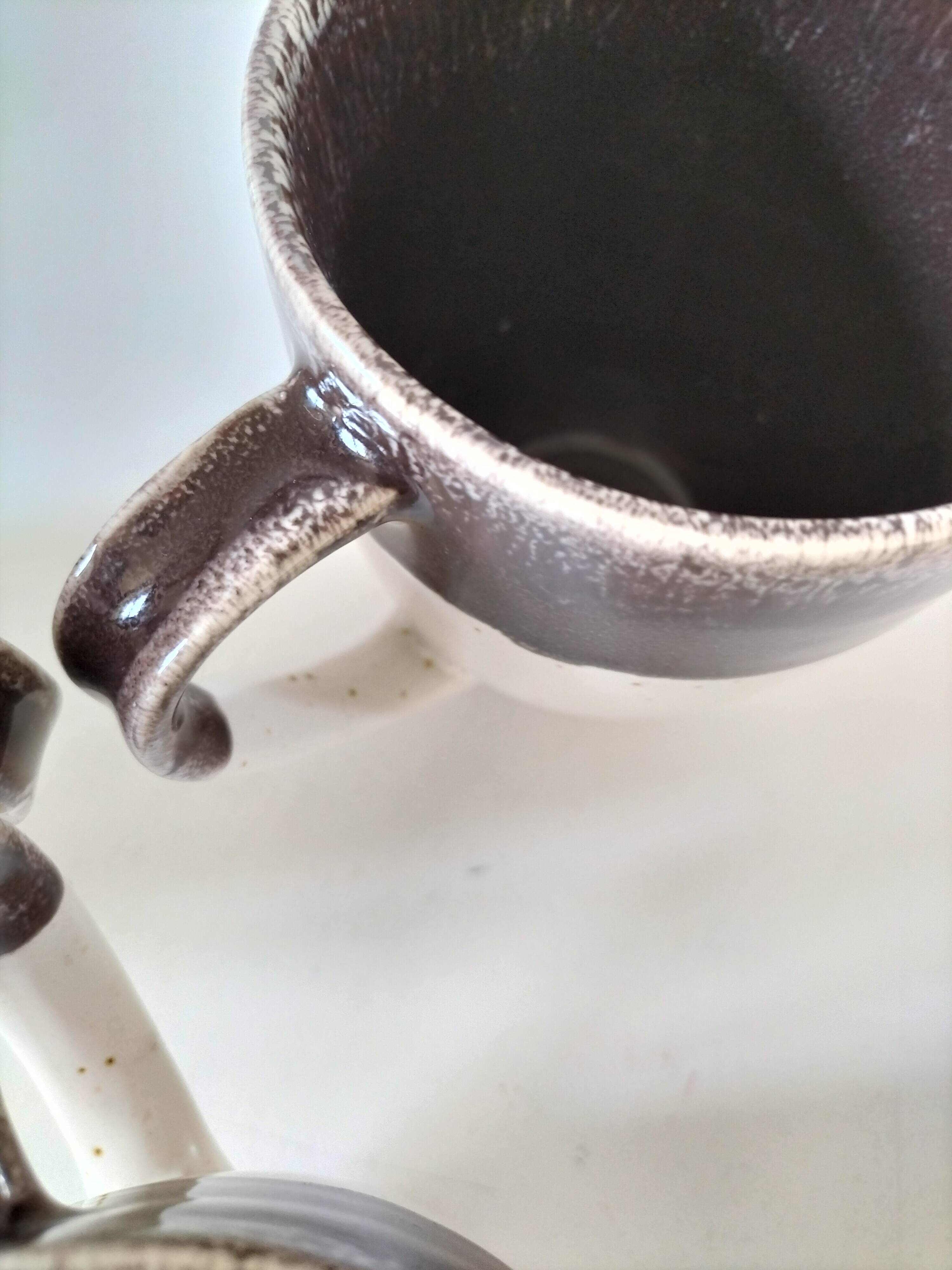 Set of three two-tone mugs, glazed stoneware, café workshop style.