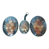 3 frames of dried flowers in curved glass