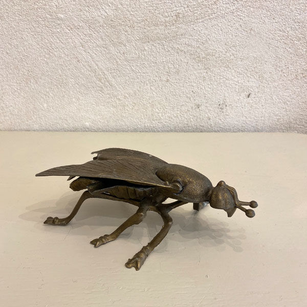 Gold metal ashtray fly