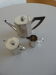 Antique silver Art Deco teapot, sugar bowl, and milk jug.