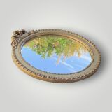 Antique small round wall mirror in gold resin - love knot