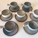 Lot 7 cups and saucers sandstone by Roger Jacques